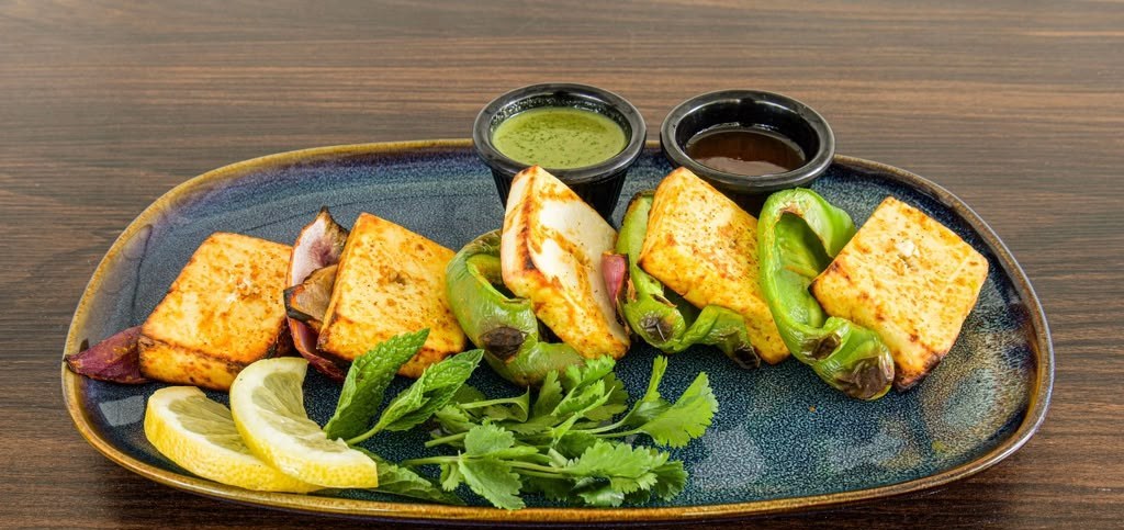 Paneer tikka with mint and tamarind chutneys